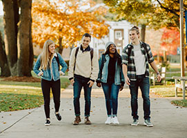 Photo of students walking on campus. Links to What to Give