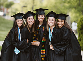 Photo of happy graduates. Links to Gifts of Life Insurance